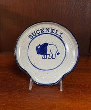 Load image into Gallery viewer, Bucknell pottery spoon rest with bison design and navy blue details.