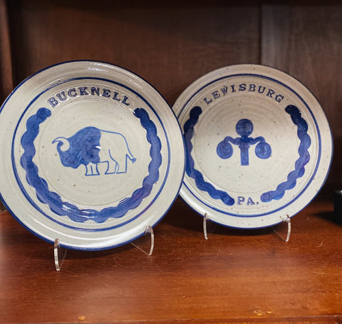 Bucknell University and Lewisburg, PA pottery plates with a lamppost and bison design.