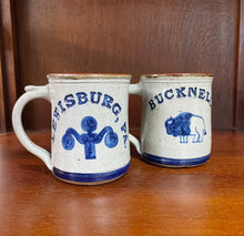 Load image into Gallery viewer, Bucknell University and Lewisburg, PA pottery mugs with a bison and lamppost design. 
