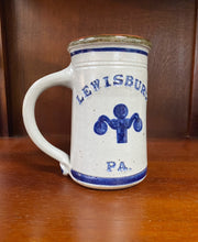 Load image into Gallery viewer, Lewisburg, PA pottery tankard with a thick handle and lamppost design.
