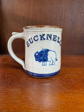 Load image into Gallery viewer, Bucknell pottery mug with a thick handle and bison design.
